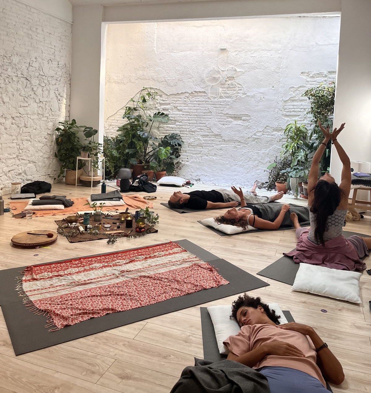 Participants resting and moving on mats during a Dreamwave immersive training